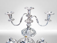 Silverplate candelabra with epergne bowls sitting in front